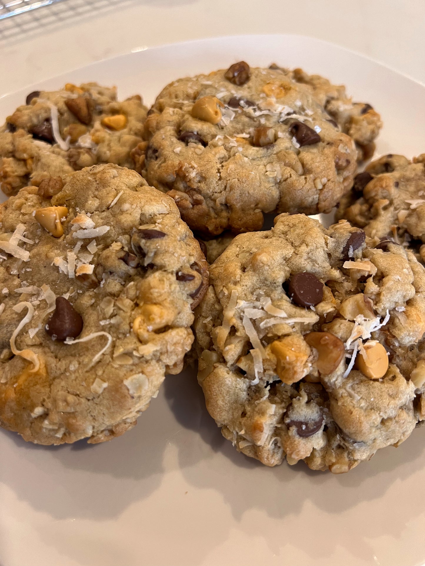 Fun spin on an oatmeal cookie. Includes: Oats, walnuts, chocolate chips, butterscotch chips and coconut